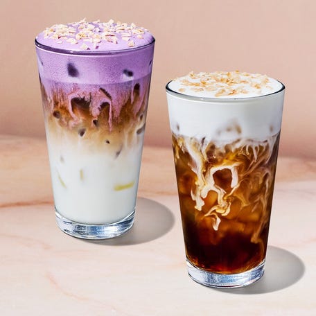 Starbucks' 2026 Spring Menu includes a new Toasted Coconut Cream Cold Brew, right, and Iced Ube Coconut Macchiato.