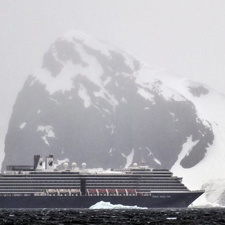 A cruise ship sails at the Gerlache Strait, which separates the Palmer Archipelago from the Antarctic Peninsula, in Antarctica on January 17, 2024.