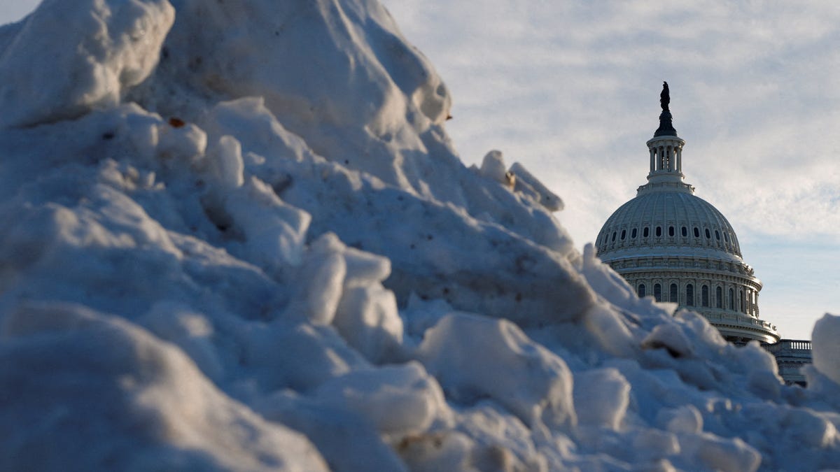 The U.S. Capitol dome rises above a pile of snow, as Congress works to resolve a dispute over immigration enforcement and avert a looming partial government shutdown, in Washington, D.C., U.S., January 29, 2026.