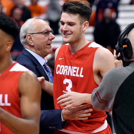 Then-Syracuse men's basketball coach Jim Boeheim greets his son, Jimmy, who was playing for Cornell, during a 2018 game. Jimmy later played a year for his dad at Syracuse.