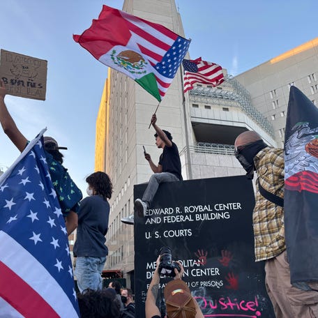 Anti-ICE protestors gathered at the Edward Roybal Federal Court Building in downtown Los Angeles on Friday, Jan. 30.