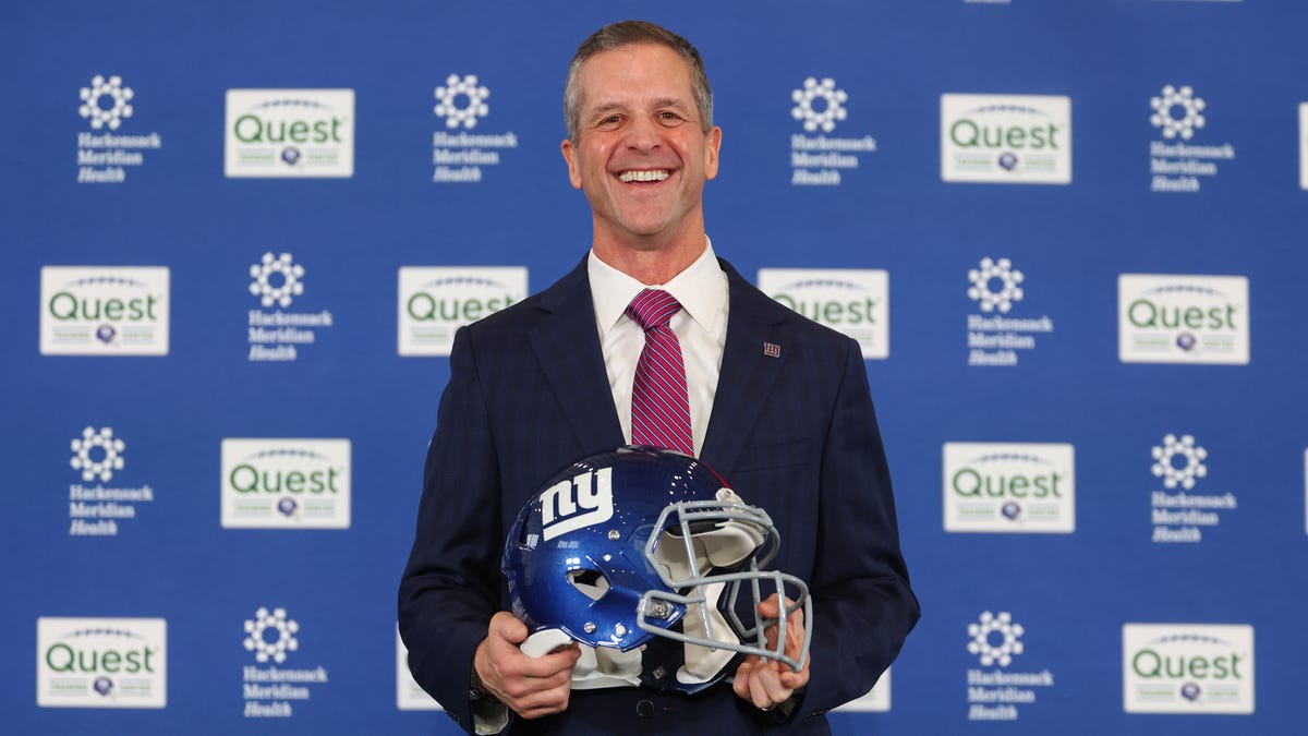 John Harbaugh poses after the press conference announcing his hiring as the next New York Giants head coach at Quest Diagnostics Training Center.