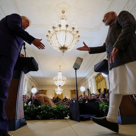 U.S. President Donald Trump and Indian Prime Minister Narendra Modi prepare to shake hands as they attend a joint press conference at the White House in Washington, D.C., U.S., February 13, 2025. REUTERS/Kevin Lamarque TPX IMAGES OF THE DAY