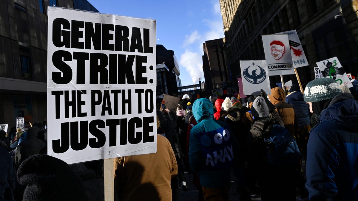 Demonstrators participate in a march rally during an "ICE Out" day of protest in Minneapolis on Jan. 23, 2026.