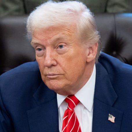 President Donald Trump is pictured speaking with reporters at the White House after signing a funding bill on Feb. 3, 2026.