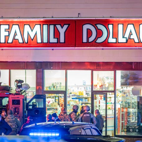 A police tactical unit, seen outside the Family Dollar store, confronted the suspect, according to a prosecutor.