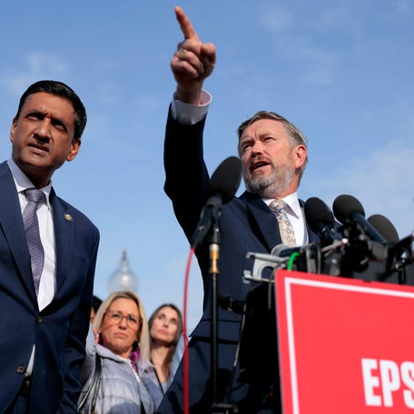 U.S. Rep. Thomas Massie (R-KY) gestures as U.S. Rep. Ro Khanna (D-CA) (L) looks on during a news conference on the Epstein Files Transparency Act outside the U.S. Capitol on November 18, 2025 in Washington, DC.