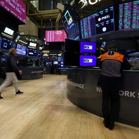 FILE PHOTO: Traders work on the floor at the New York Stock Exchange (NYSE) in New York City, U.S., January 28, 2026. REUTERS/Brendan McDermid/File Photo