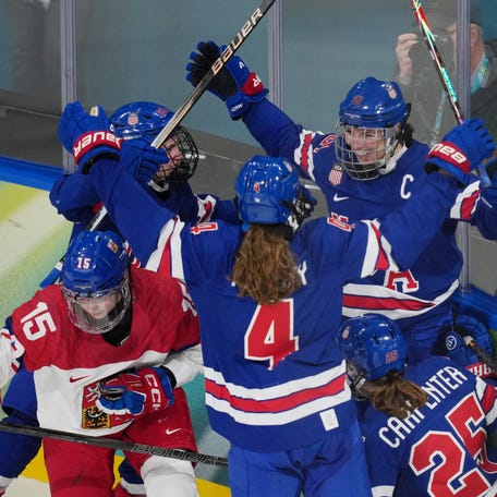 Team USA's Hilary Knight (21) celebrates with teammates after scoring a goal against Czechia in the second period.
