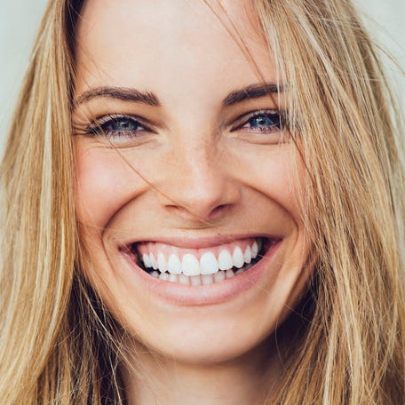 Portrait of young woman with beautiful smile
