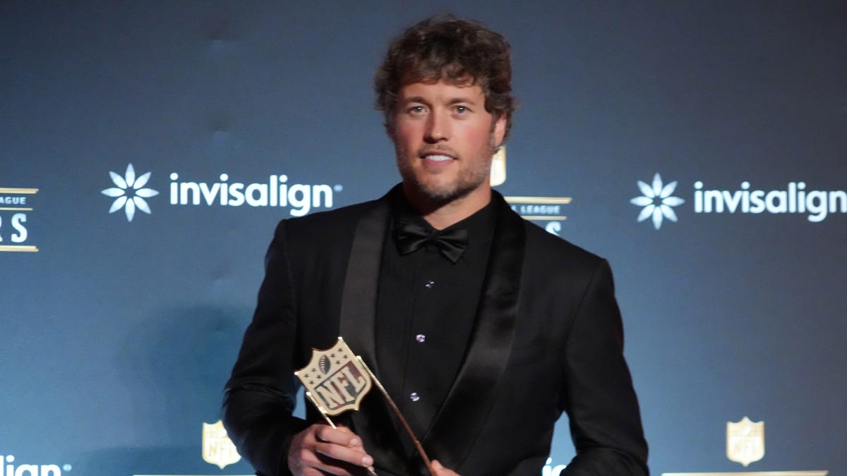Los Angeles Rams quarterback Matthew Stafford poses with the MVP trophy.
