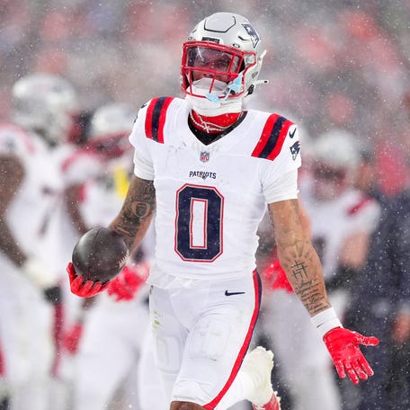 New England Patriots cornerback Christian Gonzalez (0) reacts after an interception against the Denver Broncos during the second half of the AFC title game.