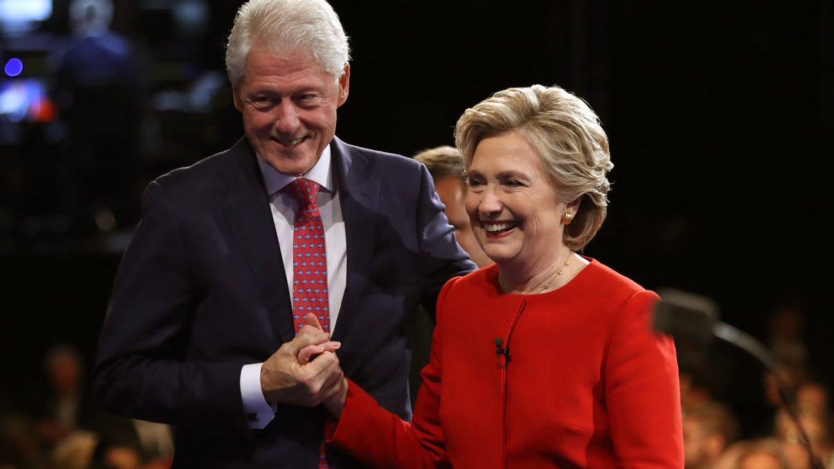 Democratic U.S. presidential nominee Hillary Clinton holds hands with her husband, former President Bill Clinton, as they leave the stage after the conclusion of the first debate with Republican U.S. presidential nominee Donald Trump at Hofstra University in Hempstead, New York, U.S., September 26, 2016.