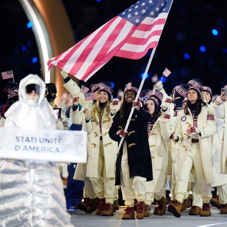 Athletes from the United States are led by flag bearer Erin Jackson during the opening ceremony for the Milano Cortina 2026 Olympic Winter Games at Milano San Siro Olympic Stadium in Milan, Italy on Feb. 6, 2026.