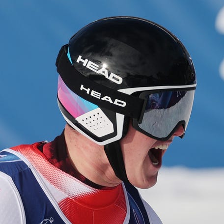 Franjo von Allmen of Switzerland reacts after crossing the finish line during the men's downhill on Day 1 of the Milano Cortina 2026 Winter Olympics at Stelvio Alpine Skiing Centre.