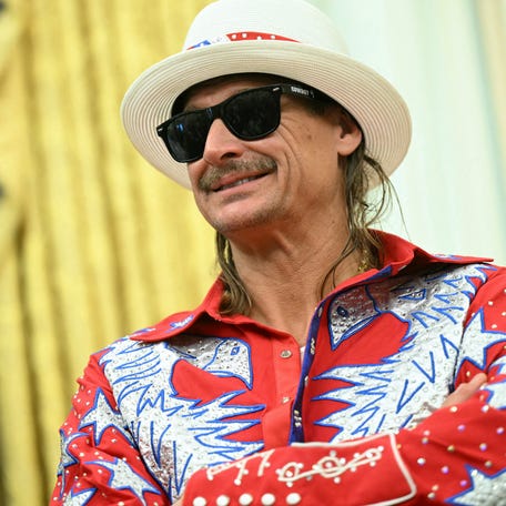 Kid Rock looks on as President Donald Trump signs an executive order targeting ticket scalping at the White House on March 31, 2025.