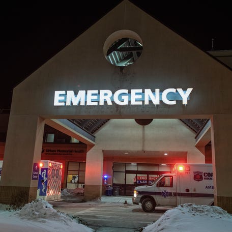 Ambulances from Coastal Ambulance line up outside the emergency entrance, during the evacuation of patients from UMass Memorial Marlborough, Feb. 8, 2026.