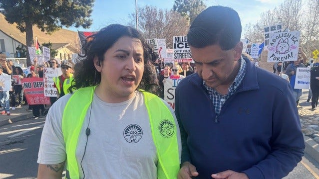 Lyla Salinas, left, a member of CSO San Jose, talks with California Democratic Congressman Ro Khanna during an "ICE out of Super Bowl Protest" in Santa Clara, Calif. on Feb. 8, 2026. Hundreds took place in the protest occurred about a mile away from the big game.