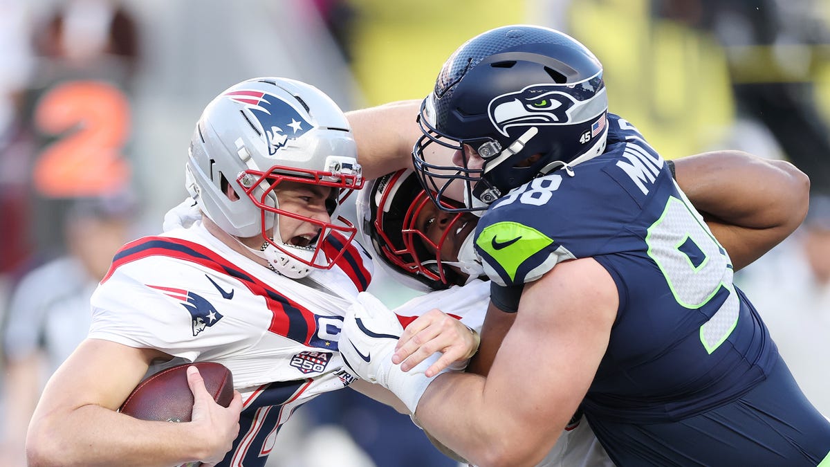 Drake Maye #10 of the New England Patriots is sacked by Rylie Mills #98 of the Seattle Seahawks during the second quarter in Super Bowl LX at Levi's Stadium on February 08, 2026 in Santa Clara, California.