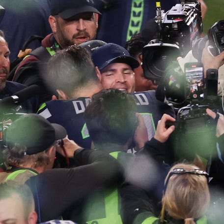 Seattle Seahawks quarterback #14 Sam Darnold hugs head coach Mike Macdonald after the Seahawks' victory over the New England Patriots during Super Bowl LX at Levi's Stadium in Santa Clara, California, on Feb. 8, 2026.