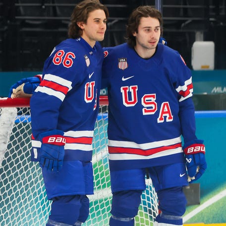 MILAN, ITALY - FEBRUARY 09: Jack Hughes #86 and Quinn Hughes #43 of Team United States pose for photographs during training on day three of the Milano Cortina 2026 Winter Olympic games at Milano Santagiulia Ice Hockey Arena on February 09, 2026 in Milan, Italy. (Photo by Bruce Bennett/Getty Images)