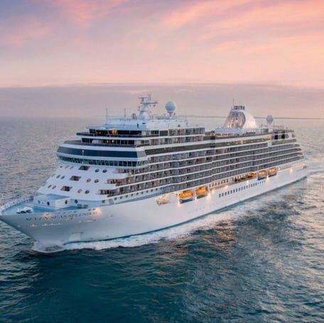 Regent Seven Seas Splendor sailing in the sunset.