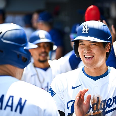 Aug 17, 2025; Los Angeles, California, USA; Los Angeles Dodgers designated hitter Shohei Ohtani (17) celebrates after first baseman Freddie Freeman (5) hits a three run home run in the first inning against the San Diego Padres at Dodger Stadium. Mandatory Credit: Jonathan Hui-Imagn Images