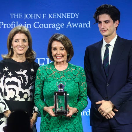 House Speaker Nancy Pelosi receives the Profile In Courage Award from Caroline Kennedy, left, and her son, Jack Schlossberg, at the John F. Kennedy Presidential Library in Boston on May 19, 2019.