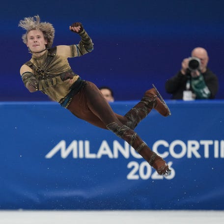 Feb 10, 2026; Milan, Italy; Ilia Malinin of the United States of America competes in men's singles short program during the Milano Cortina 2026 Olympic Winter Games at Milano Ice Skating Arena. Mandatory Credit: James Lang-Imagn Images