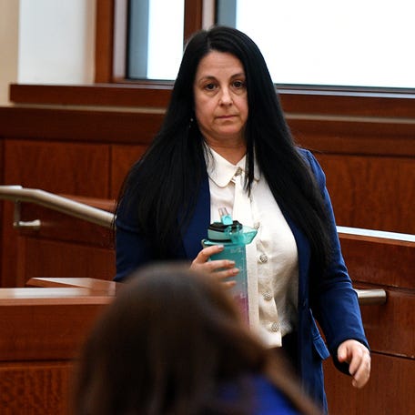 On day two of her trial on charges of assault and battery on a police officer and interference with police, former District 5 City Councilor Etel Haxhiaj steps down after testifying.