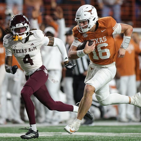 AUSTIN, TEXAS - NOVEMBER 28: Arch Manning #16 of the Texas Longhorns runs for a fourth quarter touchdown against the Texas A&M Aggies at Darrell K Royal-Texas Memorial Stadium on November 28, 2025 in Austin, Texas. (Photo by Alex Slitz/Getty Images)