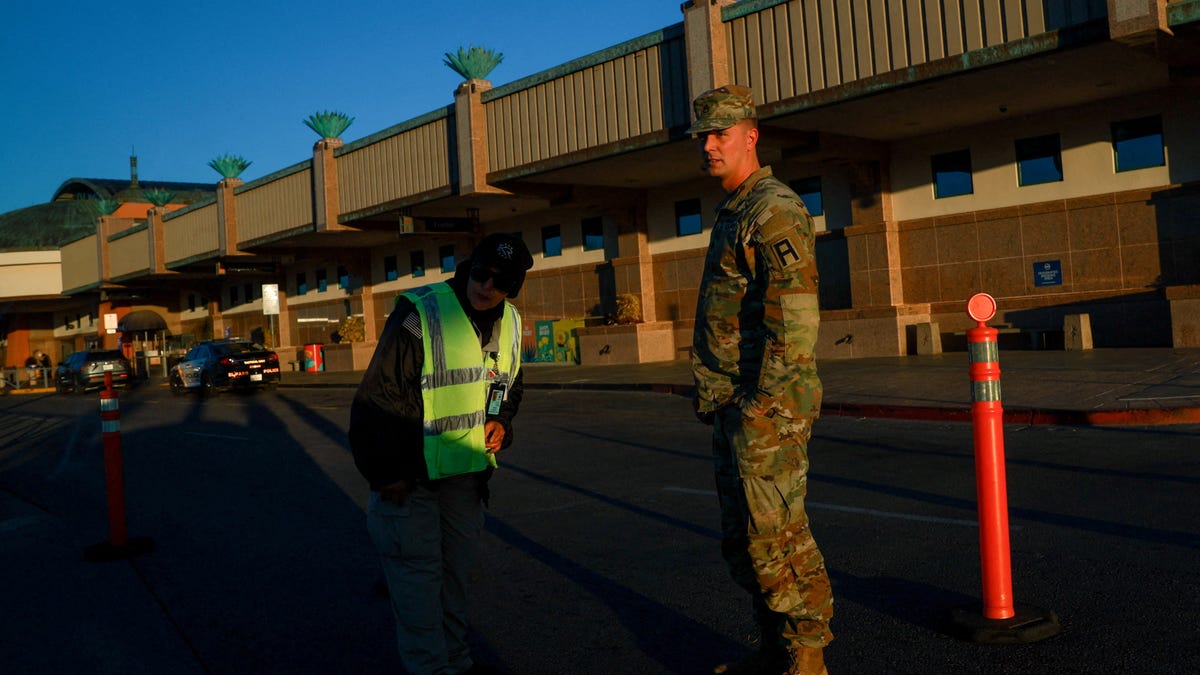 Security personnel outside El Paso International Airport after the U.S. Federal Aviation Administration lifted its temporary closure of the airspace over El Paso, saying all flights will resume as normal and that there was no threat to commercial aviation, in El Paso, Texas, U.S., February 11, 2026. REUTERS/Jose Luis Gonzalez REFILE - CHANGING SLUG FROM "TEXAS-AIRSPACE/" TO "USA-TEXAS/AIRSPACE".