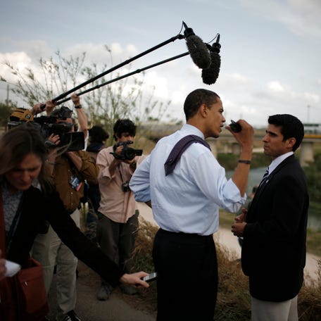Sen. Barack Obama, D-Illinois, then a Democratic presidential hopeful, walks near the border of Mexico during a tour in 2008 in Brownsville, Texas.
