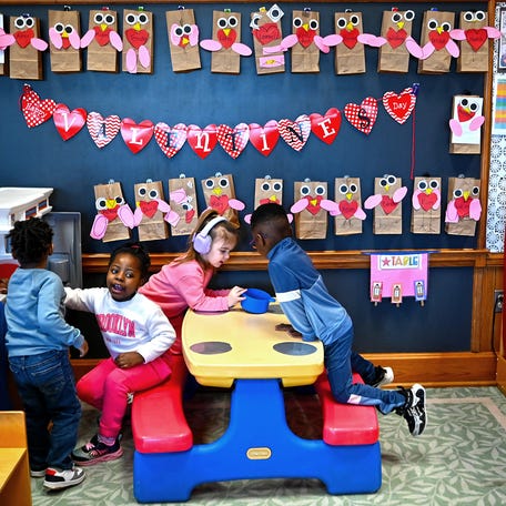 Preschool students play together at Quinsigamond Elementary School in Worcester.