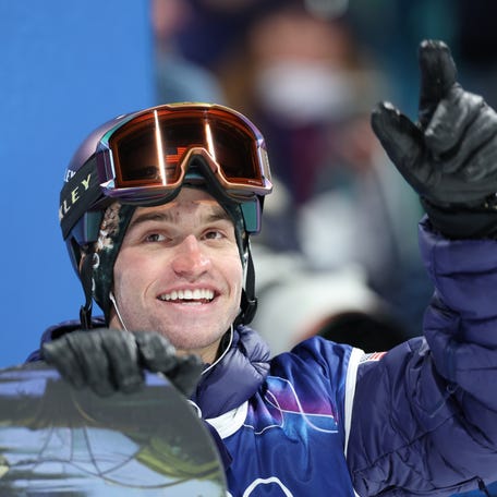 Feb 11, 2026; Livigno, Italy; Jake Pates of the United States reacts after his run in the men's snowboard halfpipe qualification during the Milano Cortina 2026 Olympic Winter Games at Livigno Snow Park. Mandatory Credit: Nathan Ray Seebeck-Imagn Images