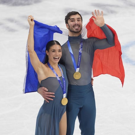 Laurence Fournier Beaudry and Guillaume Cizeron of France skate after receiving their medals during the Milano Cortina 2026 Olympic Winter Games at Milano Ice Skating Arena on Feb 11, 2026.