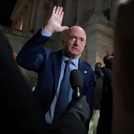 U.S. Senator Mark Kelly (D-AZ) speaks with reporters as he departs the U.S. Capitol after an evening vote in Washington, D.C., U.S., January 12, 2026.