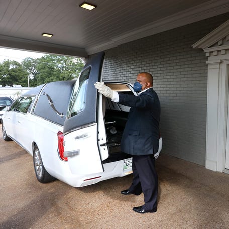 Marquis Lacey, director of operations, at RS Lewis & Sons Funeral Home prepares a hearse for the pickup of a body on Tuesday, Aug. 31, 2021, where they have seen a large increase in covid-related deaths during the month of August. "I already don't sleep a lot of hours, but it's mentally challenging... it has been taxing. At the end of the day I want to make certain that my children are safe, that I am safe," said Lacey of working during the pandemic.    Jrca7969
