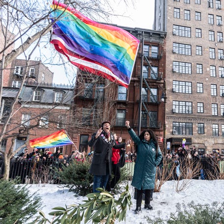 After elected officials raised a Pride flag on a temporary flagpole, activists raise the flag on the permanent flagpole at the Stonewall National Monument in New York City Feb. 12, 2026. Thousands gathered at the monument to see the flag raised after President Donald Trump had ordered the flag to be removed earlier in the week.