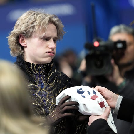 Feb 13, 2026; Milan, Italy; Ilia Malinin of the United States of America reacts after competing in the men's singles free program during the Milano Cortina 2026 Olympic Winter Games at Milano Ice Skating Arena. Mandatory Credit: James Lang-Imagn Images