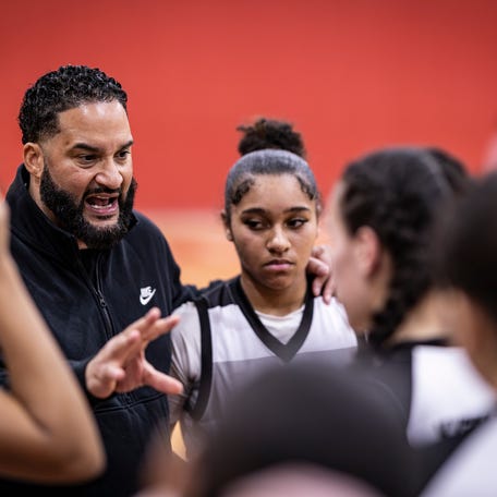 South High girls' basketball coach Diago McClain speaks to his team during a game against Leominster on Feb. 13.