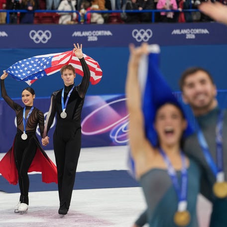 Madison Chock and Evan Bates of the United States skate after receiving silver medals during the Milano Cortina 2026 Olympic Winter Games at Milano Ice Skating Arena.