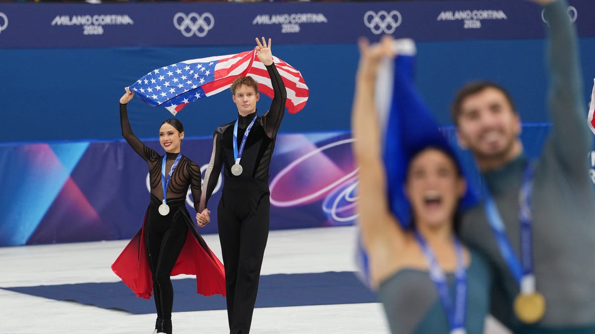 Madison Chock and Evan Bates of the United States skate after receiving silver medals during the Milano Cortina 2026 Olympic Winter Games at Milano Ice Skating Arena.