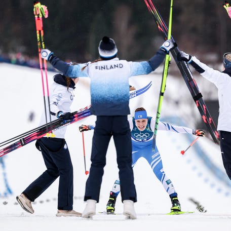 Jasmi Joensuu of Team Finland celebrates winning bronze during the Women's 4 x 7.5km Cross-Country Relay on day eight of the Milano Cortina 2026 Winter Olympic games at Tesero Cross-Country Skiing Stadium on Feb. 14, 2026 in Val di Fiemme, Italy.