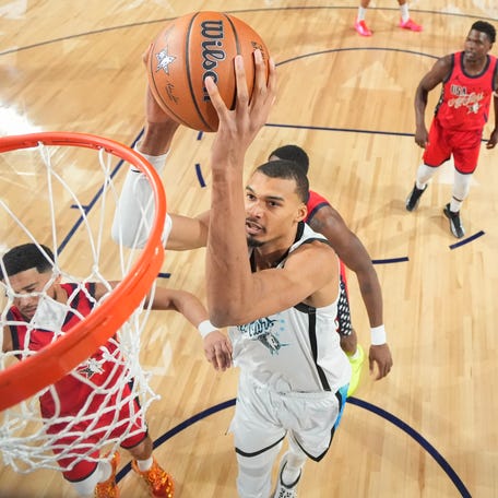 INGLEWOOD, CALIFORNIA - FEBRUARY 15: (EDITORS NOTE: Image Has Been Taken Using A Static Remote Camera.) Victor Wembanyama #1 of the San Antonio Spurs and Team World shoots against Jalen Duren #0 of the Detroit Pistons and Team USA Stars during the 75th NBA All-Star Game at Intuit Dome on February 15, 2026 in Inglewood, California. (Photo by Ronald Martinez/Getty Images)