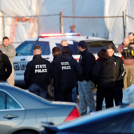Police stand outside the Dennis M. Lynch Arena in Pawtucket after the Feb. 16 fatal shooting during a high school hockey game.