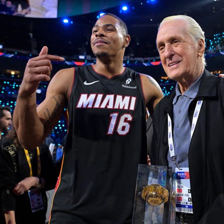 Miami Heat forward Keshad Johnson celebrates with the trophy and team president Pat Riley after winning the slam dunk competition during the 2026 NBA All-Star Saturday Night at Intuit Dome in Inglewood, California on Feb. 14, 2026.