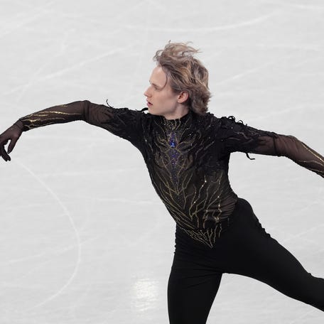 Ilia Malinin of the United States of America competes in the men's singles free program during the Milano Cortina 2026 Olympic Winter Games at Milano Ice Skating Arena.