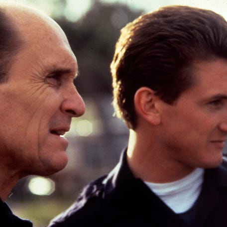 Robert Duvall, left, and Sean Penn in a scene from the motion picture "Colors." 1988