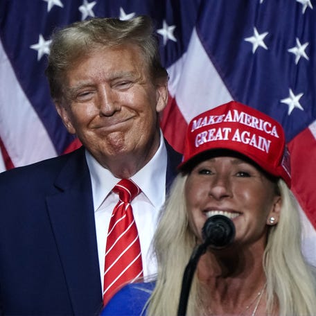 Former Rep. Marjorie Taylor Greene speaks alongside Donald Trump at a campaign event in Rome, Georgia, on March 9, 2024. Greene resigned from her seat after Trump targeted her, withdrew his endorsement and called for a primary challenge.